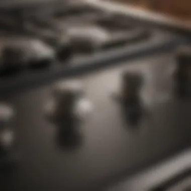 Close-up of gas range knobs and controls