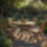 Elegant wooden garden chairs arranged around a stone table