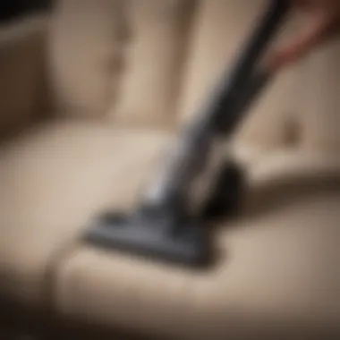 Demonstration of a handheld vacuum cleaning upholstery