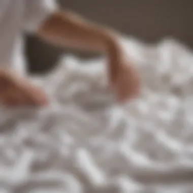 Person sorting laundry with white garments